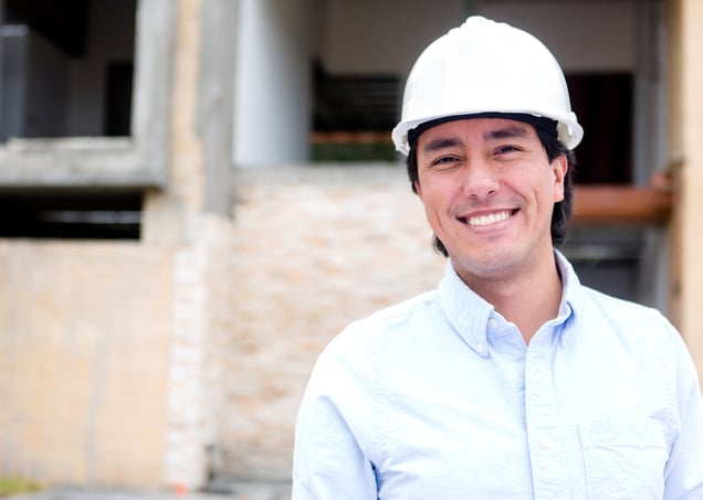 Male engineer in a construction site wearing a helmet